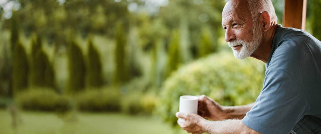 A man practicing mindfulness in a serene setting, illustrating techniques for stress management specifically for men.