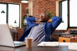 “High achiever taking a mindful pause at desk”